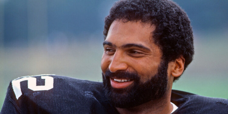 LATROBE, PA - JULY 1982:  Running back Franco Harris of the Pittsburgh Steelers smiles as he looks on from the field during summer training camp at St. Vincent College in July 1982 in Latrobe, Pennsylvania.  (Photo by George Gojkovich/Getty Images)